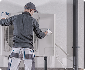 technician checking airconditioner